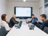 Team von FIVE Informatik im Sitzungszimmer